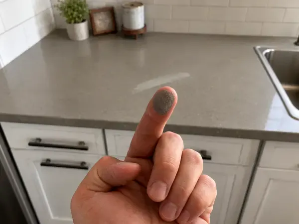Dust left on a counter after a poor cleaning job